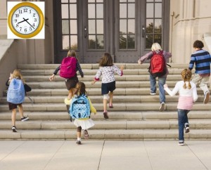 Children running up school steps